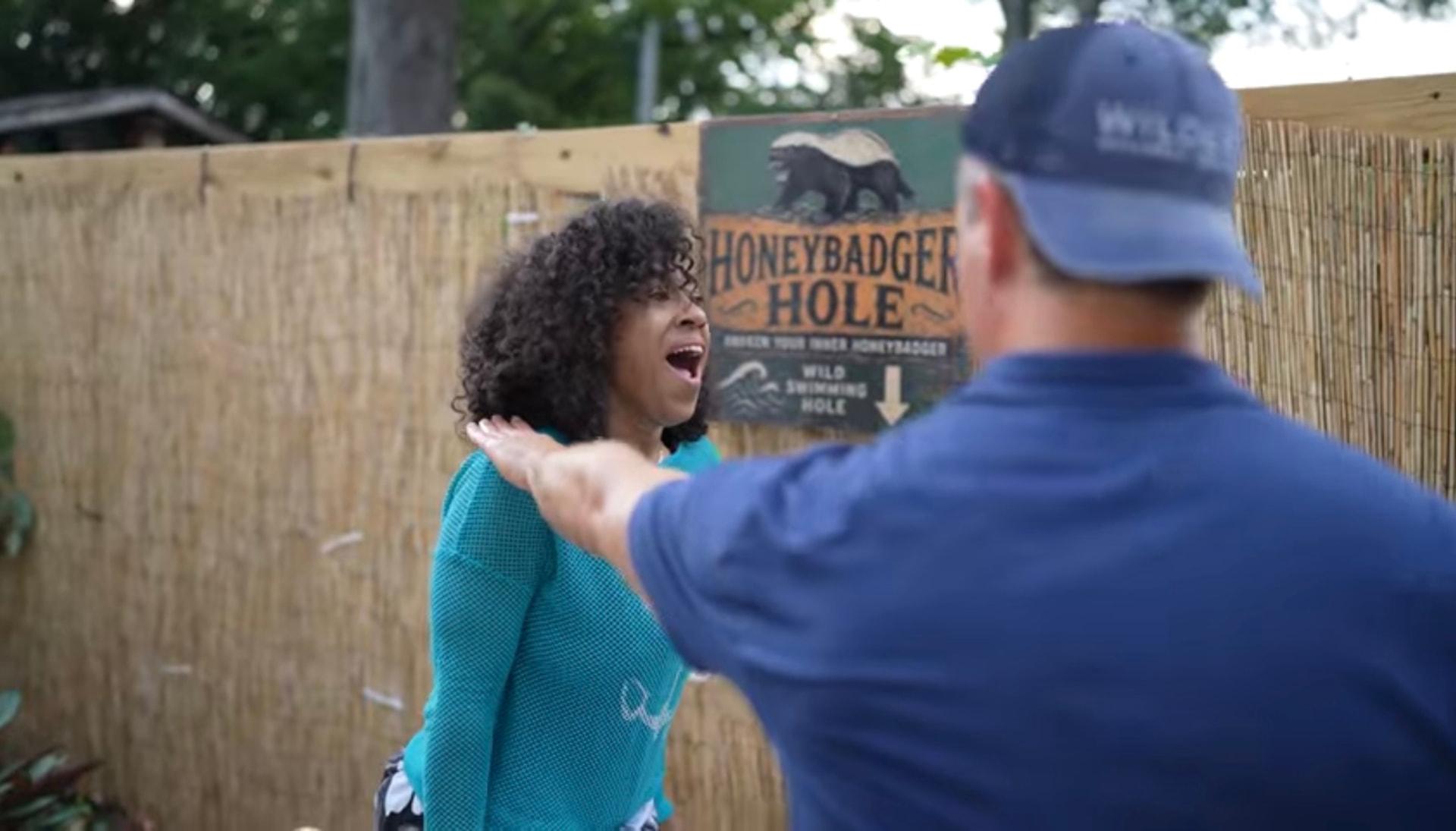 A participant laughing after her cold plunge at the Honeybadger Hole